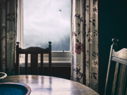 interior-scene-with-dining-table-and-window-in-background